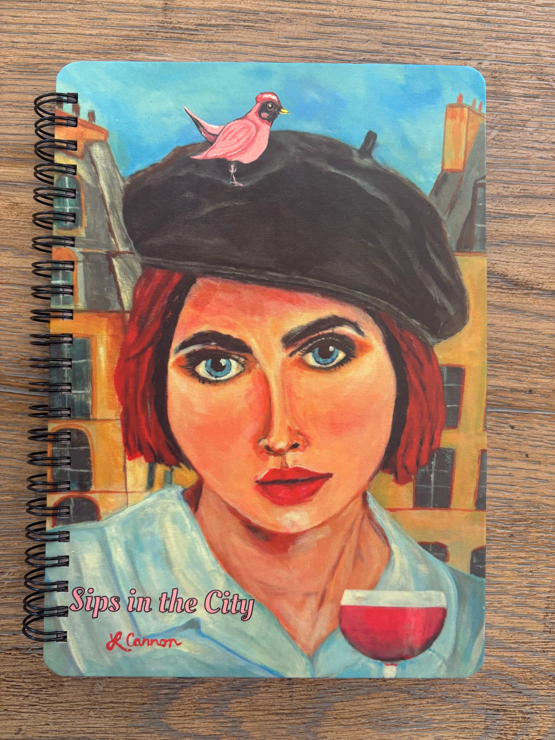 Journal with spiral of women with a bird on her head in paris
