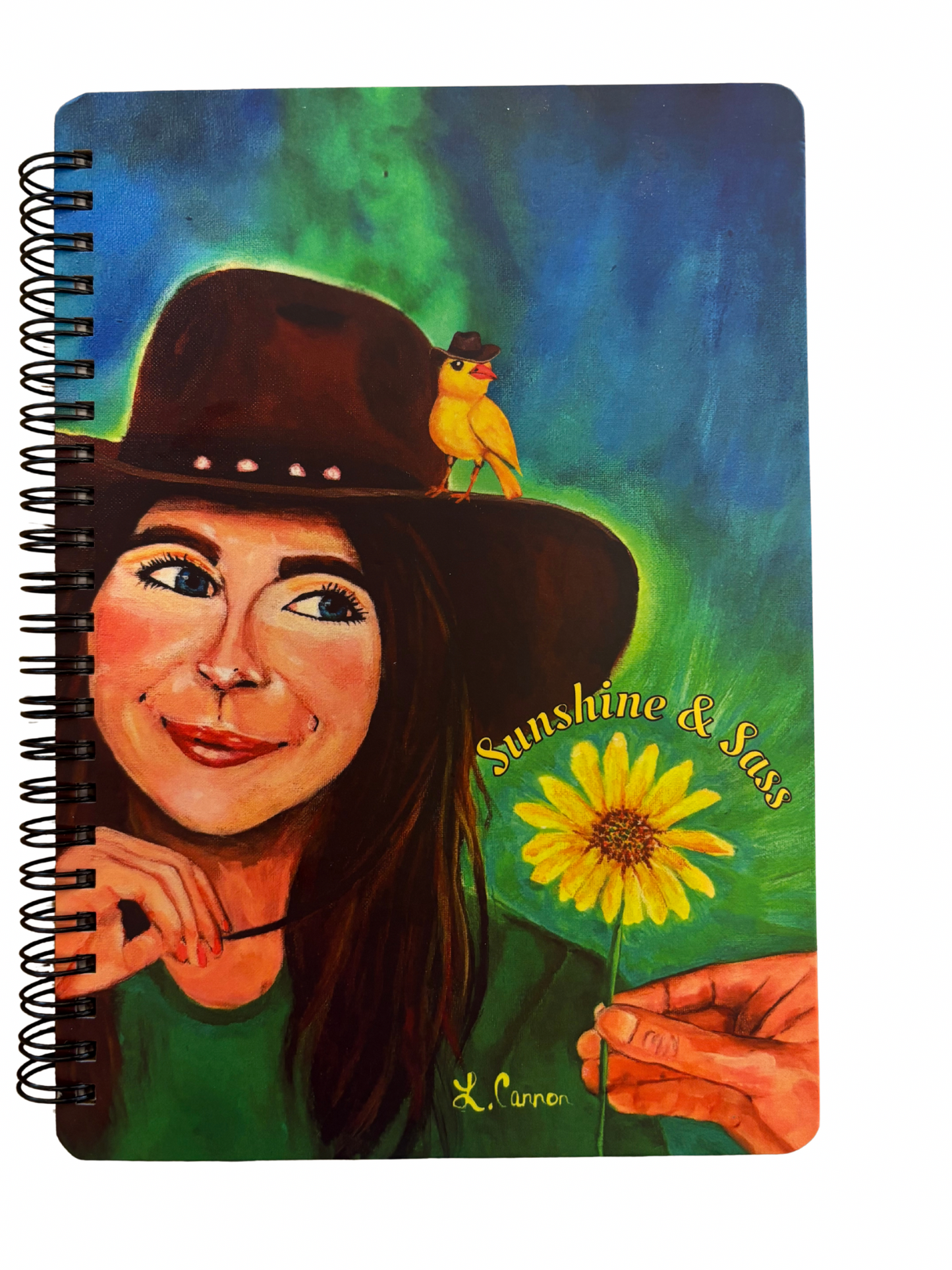 Notebook with colorful design of women in a cowboy hat, a yellow bird and sunflower