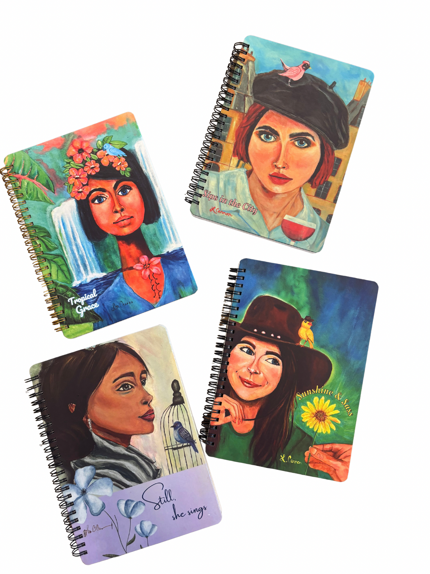 All four notebooks from the Femmes & Feathers collection—featuring vibrant feminine illustrated covers with birds and nature themes—displayed together as a colorful artistic journal set.