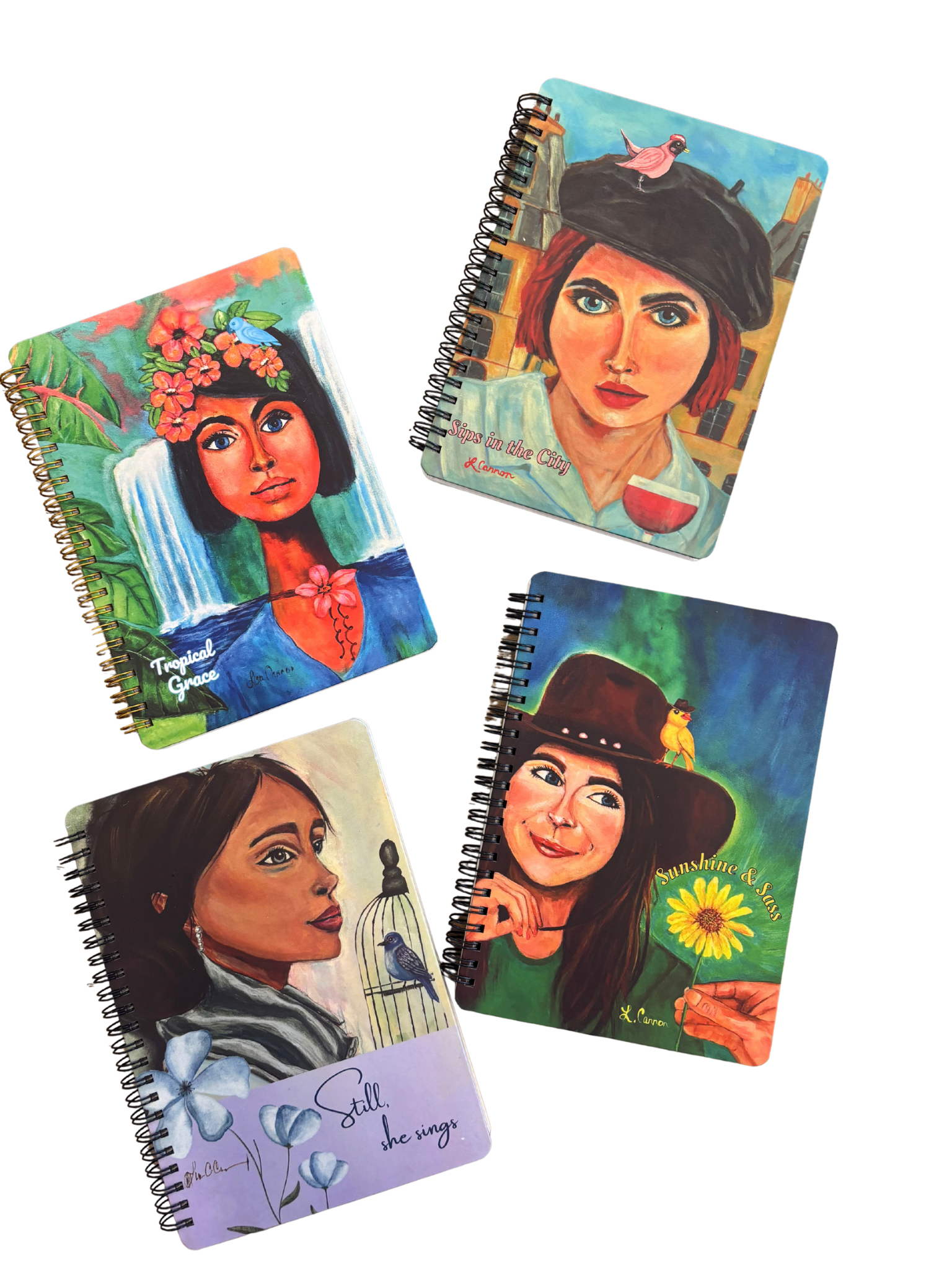 All four notebooks from the Femmes & Feathers collection—featuring vibrant feminine illustrated covers with birds and nature themes—displayed together as a colorful artistic journal set.
