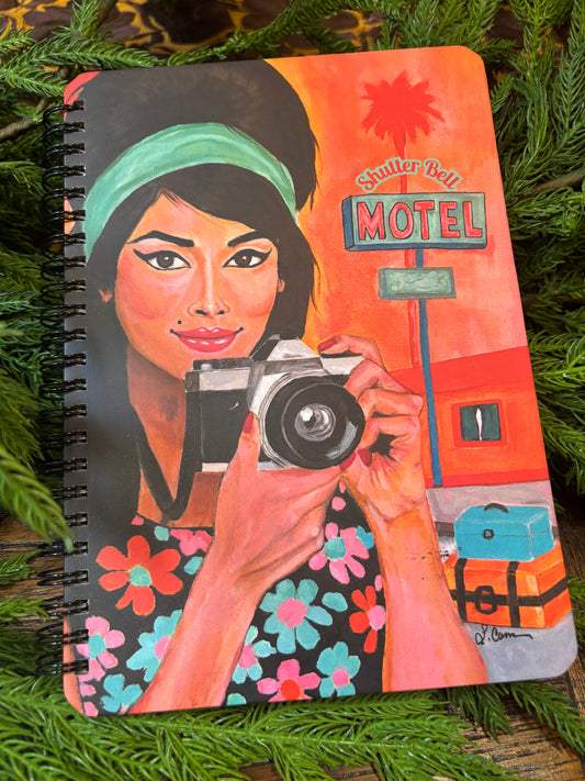 Shutter Bell colorful art notebook with illustrated female portrait cover
