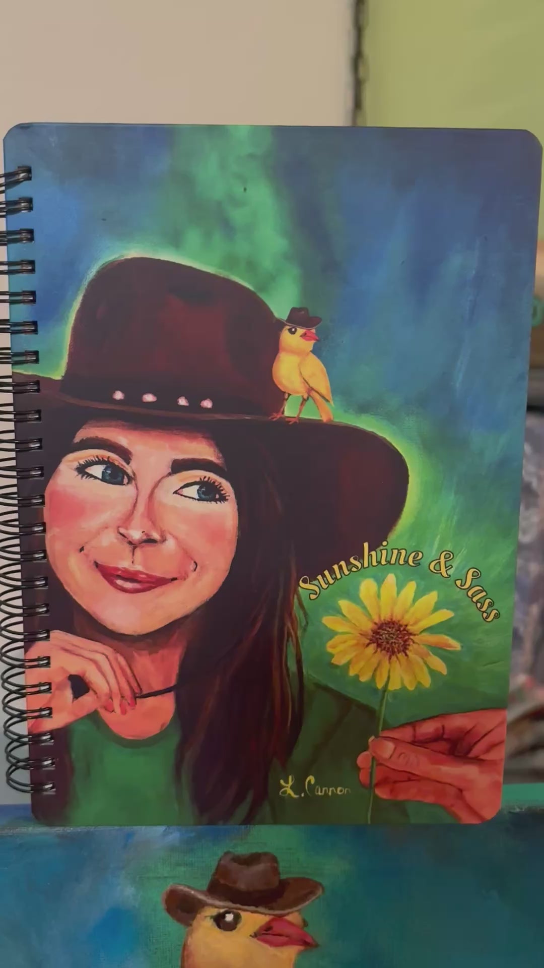 Video of Sunshine and Sass notebook showing the original art turned into a notebook for journaling