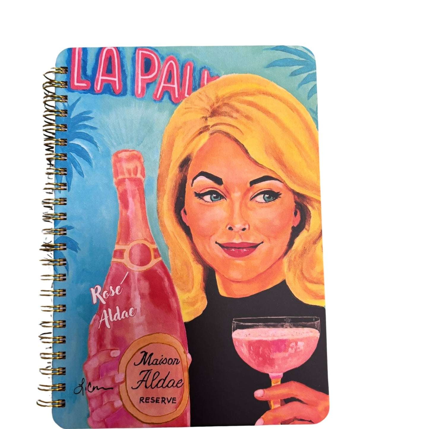 Notebook with a design of a vintage woman holding a pink cocktail and a bottle of Aldric Rose, with 'La Palma' text in the background.
